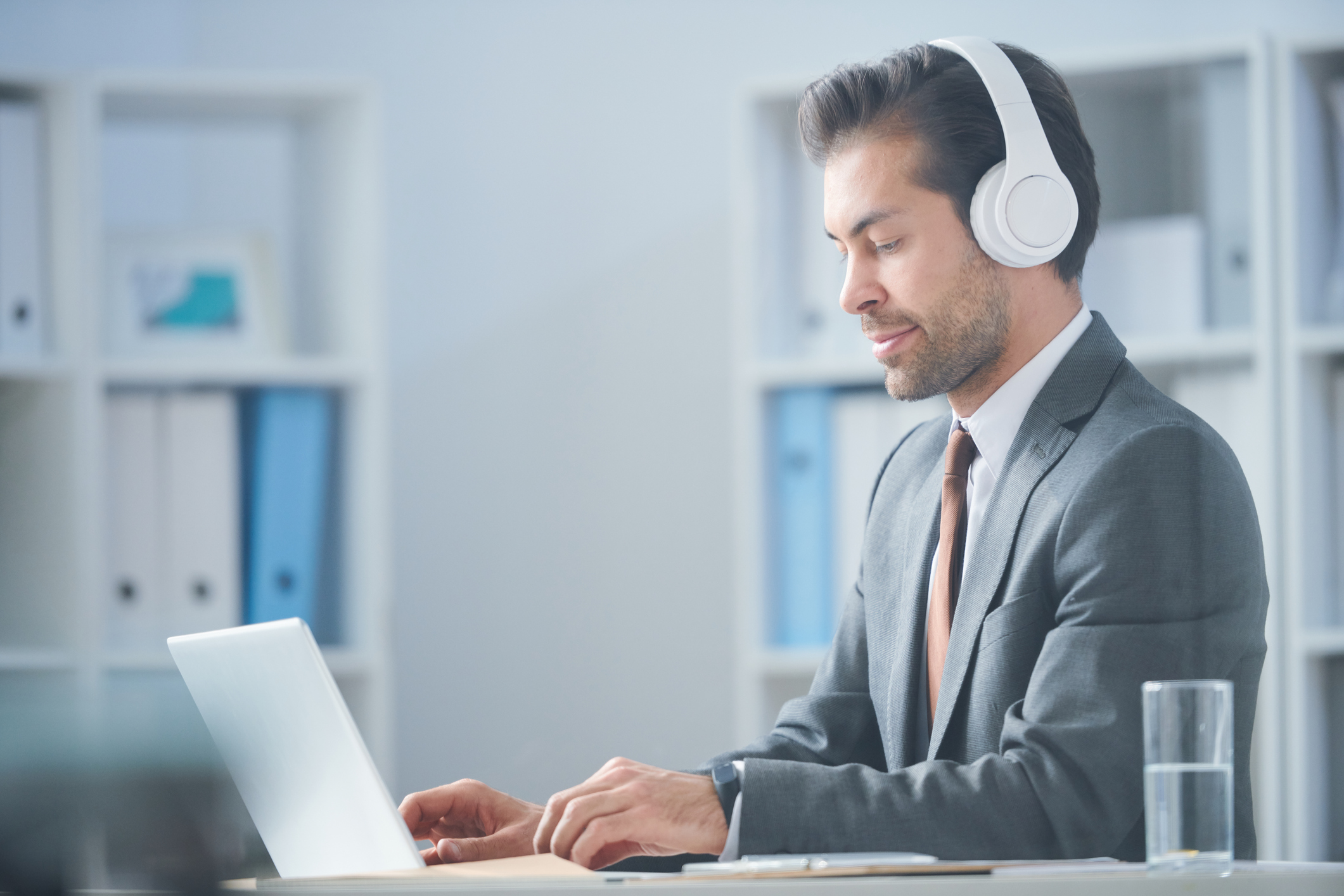 businessman in headphones watching online video