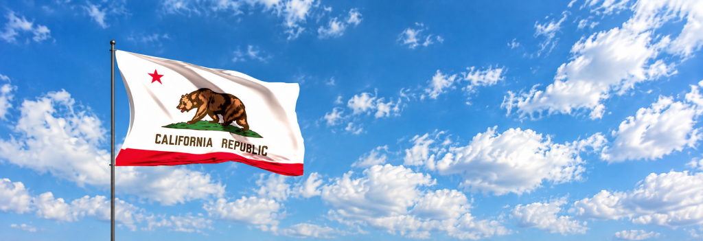 California Flag Billowing Under Blue Skies
