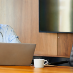 Doctor reviewing notes on laptop